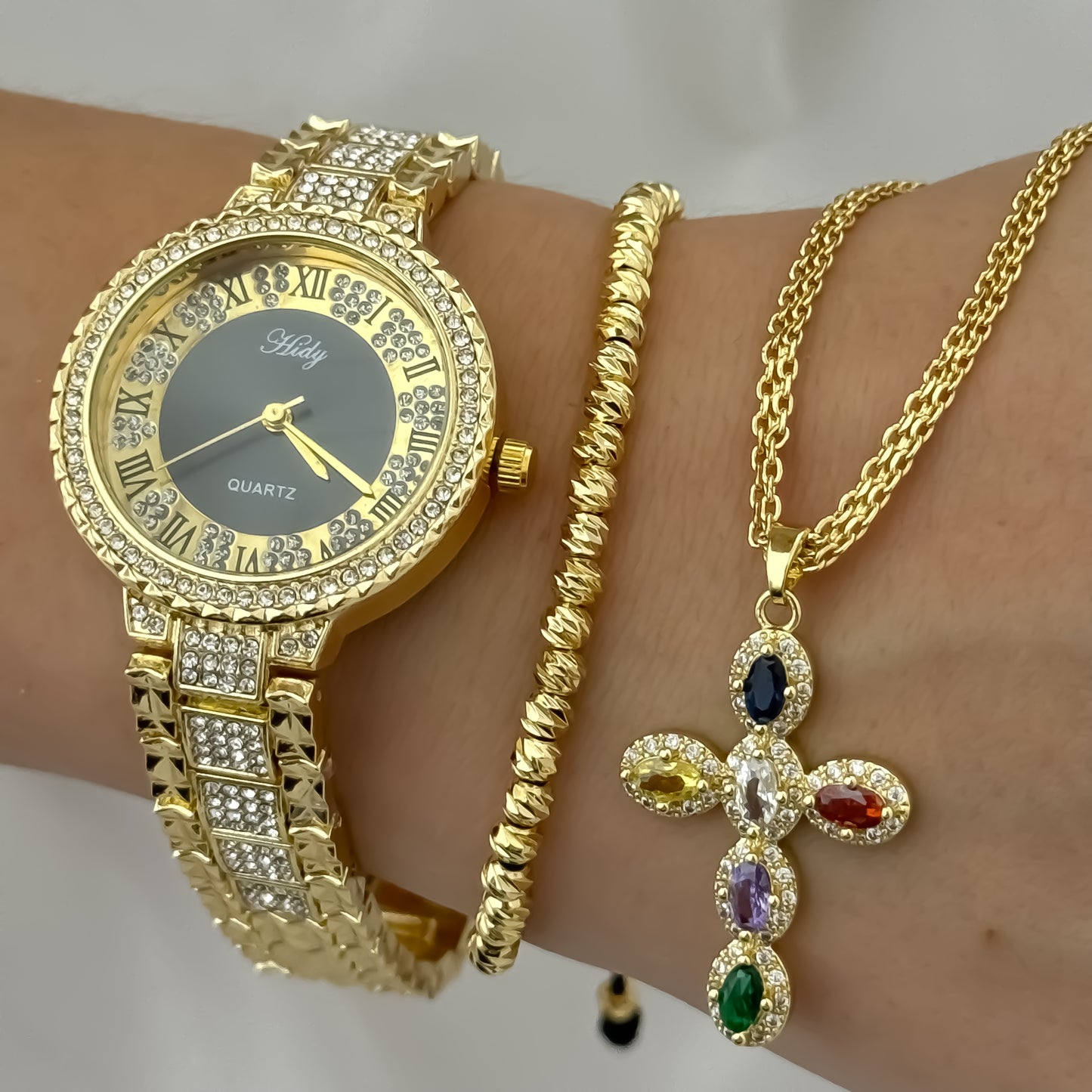 conjunto cadena Tejido chino + Cruz Circones de Colores + Pulsera Balin 4mm en baño de oro de 18k + reloj de dama